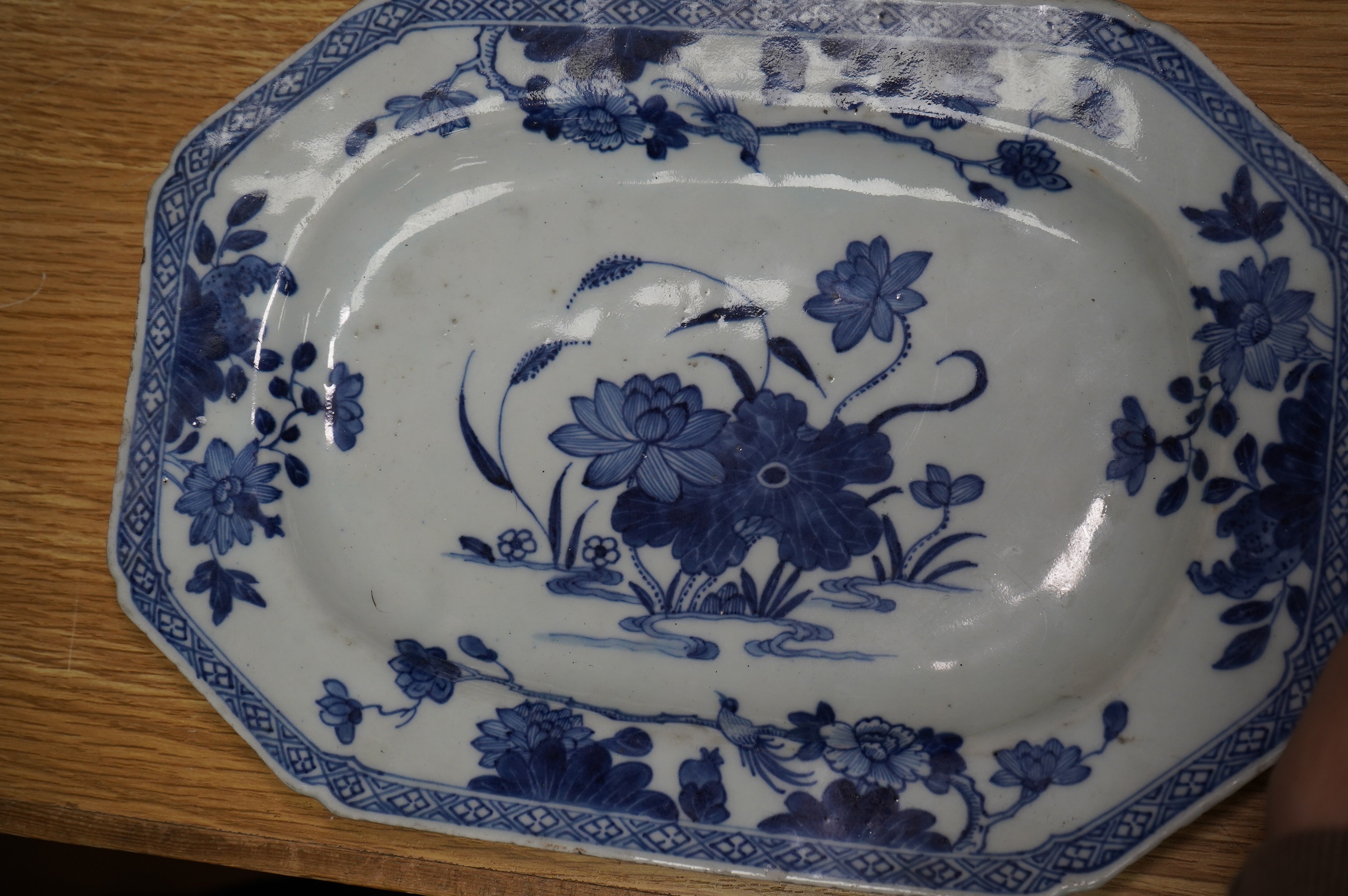 An 18th century Chinese Export serving dish and (repaired) plate, largest 32cm. Condition - poor